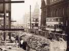 Trams on Flat Street showing (right) the General Post Office and the construction of the Odeon Cinema, [1954]