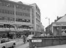 Change Alley from High Street showing (l. to r.)  Kendall and Sons Ltd., umbrella makers, F. Corker and Son Ltd., fruiterers and and No. 58 Central Dairy Products Ltd.