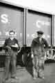 View: s46056 Gordon Avery (left) and Billy Gauntley (right) outside Cravens Ltd., rolling stock manufacturers, Acres Hill Lane 