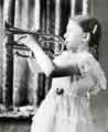 View: s46062 Marie Fawbert, aged 10, playing the trumpet