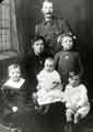 View: s46126 Mrs Williamson of Darnall (centre) sitting on her mother's knee