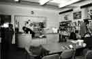 View: s46155 Sports Library, Central Library showing Lesley Gunter, librarian (2nd left on telephone)