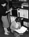 View: s46449 Library assistants (left) Betty Holmes and (sitting) Ann Hasler, Commerce and Technology Library, Central Library, Surrey Street