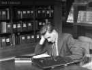 View: s46472 Reader studying a trade catalogue, Commerce, Science and Technology Library, Central Library, Surrey Street