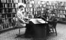 View: s46515 Radio Sheffield presenter Michael Cooke (right) interviews local studies librarian, Martin Olive, Music Library,Central Library