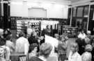 View: s46522 Book launch of Margaret Drabble's 'The Radiant Way', showing (l. to r. in front of display boards) Councillor Viv Nicholson, Margaret Drabble and Director of Libraries, Pat Coleman, Central Lending Library, Central Library