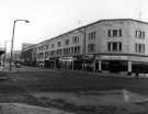 View: s46550 Shops on The Moor showing (l. to r.) No. 115 Millets, outdoors clothing, Nos. 117 - 119 Timberland Ltd., DIY suppliers and Cranes, pianos and organs