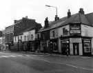 View: s46552 West Street showing (r. to l.) No. 187 Ariston Ltd., tobacconists, No. 185 John W. Hempstock, saddlers, No. 183 Billy's, hardware dealers, No. 181 Harvest Fruit and Flowers, No. 179 Marjorie Dalton Ltd., hairdressers