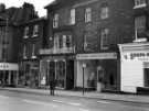 View: s46561 Glossop Road showing (l. to r.) Nos. 251 - 253 Jaeger, ladies outfitters; No. 255 Sternhall, restaurant; No. 257 A. E. Jameson and Co., antique dealers; No. 259 Stephen Matthew Estates Ltd. and No. 261 Soupa-Sarni