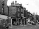 View: s46562 Glossop Road showing (l. to r.) No. 255 Sternhall, restaurant and coffee lounge; No. 257 A. E. Jameson and Co., antique dealers; No. 259 Stephen Matthew Estates Ltd.; No. 261 Soupa-Sarni and No. 263 Lloyds Bank