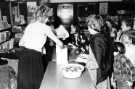 View: s46648 Apple bobbing at Halloween, Central Children's Library, Central Library, Surrey Street showing (left) library assistant, Ann Ardron