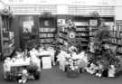 View: s46654 Cabbage patch and doll's picnic to celebrate Britain in Bloom, Central Children's Library, Central Library, Surrey Street showing (first left) Rebeccaa Sorby