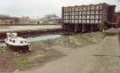 South Yorkshire Transport Executive (SYPTE). Canal basin prior to restoration showing (right) Straddle warehouse