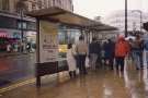 South Yorkshire Transport Executive (SYPTE). Bus shelter on High Street showing (left)  Nos. 14 - 18 HMV Music Store