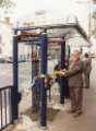 South Yorkshire Passenger Transport Executive (SYPTE). Cutting the ribbon on a new integrated telephone kiosk and bus shelter, Regent Square, Doncaster