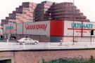 View: t11851 Queensway Furniture and Ultimate 7, electrical dealer on Moore Street at the junction with Charter Row looking towards (back) the Manpower Services Commission 