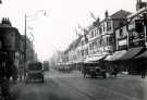 View: t11932 The Moor showing (centre) Nos. 32 - 54 Roberts Brothers Ltd. and (right) Freeman, Hardy and Willis, shoe dealers