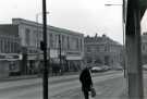 View: t11981 Shops on Attercliffe Road showing (l. to r.) No. 590 Marcway Models; No. 592 R. C. Hopkinson Ltd., grocers; No. 594 Landers Bread Ltd.; No. 596 William Timson Ltd., shoe dealers and No. 598 R. Westons Chemist Ltd.