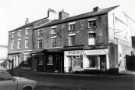 View: t12431 Bridge Street showing (right) No. 60 J. and E. McGrail, shopkeepers and No. 58 M. Burke, confectioners