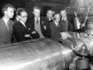 Machining the journal of a large forged steel roll, Hadfields Ltd. showing (2nd left) Fred Massey, machine shop superintendent, Hecla Works