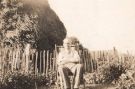 Mr T. Dunbar Cooke sitting in his garden in Holmesfield