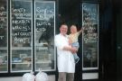 View: t13136 Dunbar Cooke and Son, fish and game merchants, No. 229 London Road showing Geoff Cooke (left) outside shop