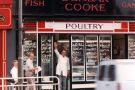 View: t13138 Last day of business, Dunbar Cooke and Son, fish and game merchants, No. 229 London Road showing Geoff Cooke outside shop