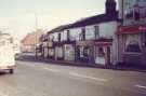 Derelict shops on London Road showing (centre) Nos. 117 Carnell Tours, coach operators and (right) No. 123 the Barrell Inn