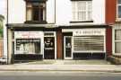 Shops on Abbeydale Road showing No. 819 Northern Domestic Appliances and No. 821 M. A. Bradshaw