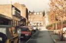 Fitzwilliam Street looking towards West Street showing (left) Gregory and Dench, Peugeot and Talbot motor dealers,