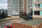 Claywood Flats showing view over garages to Norfolk tower block