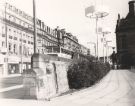 View: u11423 Pinstone Street showing (right) footpath and flag poles in the Peace Gardens