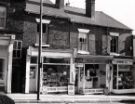 View: u11519 Barber Road showing No. 18 M. and N. Poke, newsagents and (right) No. 16 G. Worrall, chemists