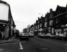 View: u11541 London Road showing (r. to l.) Nos. 150 - 152 William Hill, bookmakers; No. 154 unidentified dental surgery; No.156 Maharajah Jalsa Ghar, Indian restaurant; Bonne Marche, ladies fashions and No. 162 J. Harvey and Co., opticians