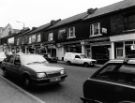 View: u11546 Shops on London Road showing (centre) Nos. 319 - 333 Cowen Barrett Ltd., plumbers merchants and kitchen shop