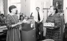 View: u11747 Cherry Mawhood (right) on her retirement from Libraries Department showing (left) Pat Coleman, Head of Libraries and (centre) Roy Wildgoose, Assistant Director of Administration