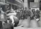 Children in Sheffield city centre waiting to use bouncy castle