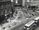 Construction of Castle Square (also known as The Hole in the Road) showing (top right) Peter Robinson Ltd., fashion department store, Nos. 51 - 57 High Street and (bottom left) No. 47 Manfield and Sons Ltd., and No. 45a Bewlay (Tobacconists) Ltd.