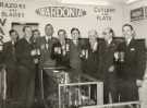 Sales representatives at the British Industries Fair, London pictured on the exhibition stand for 'Wardonia' razors and blades and cutlery and plate, Thomas Ward and Sons Ltd., cutlery manufacturers, Wardonia Works