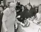 Queen Mary visiting an exhibition stand for 'Wardonia' safety razors and blades, Thomas Ward and Sons Ltd., cutlery manufacturers, Wardonia Works