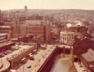 Construction of (centre left) Law Courts, Waingate showing (left) rear of Castle Market, Castlegate and Bull and Mouth public house (centre right) Ladys Bridge Hotel and (right) Hancock and Lant Ltd., furniture dealers