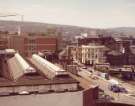 View from Castle Market, Castlegate of construction of (centre left) Law Courts, Waingate showing (centre right) Ladys Bridge Hotel and Tennant Brothers Ltd., Exchange Brewery