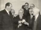 Mr G. Wilton Lee (1st left) presenting 50 year service awards, (Lee of Sheffield Ltd.) Arthur Lee and Sons Ltd., steel manufacturers at the Royal Victoria Hotel