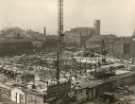 Construction of Sheffield City Hall, Barkers Pool showing (right) cars on Balm Green and (top centre) Cooperative Wholesale Society Ltd., jeans and overall factory, Nos. 70 - 82 West Street