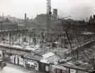 View: u13751 Construction of Sheffield City Hall, Barkers Pool showing (top centre) Co-operative Wholesale Society Ltd., jeans and overall manufacturers, Nos. 70 - 82 West Street and (right) Balm Green