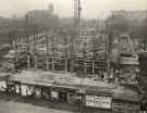 View: u13755 Construction of Sheffield City Hall, Barkers Pool showing (top left) Co-operative Wholesale Society Ltd., jeans and overall manufacturers, Nos. 70 - 82 West Street