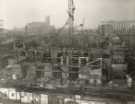 Construction of Sheffield City Hall, Barkers Pool showing (top left) Co-operative Wholesale Society Ltd., jeans and overall manufacturers, Nos. 70 - 82 West Street