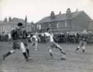 R. Lee outnumbered 3 to 1 during a second half attack in the Amateur League final, Sheffield Rovers FC v. Oak Street FC at the Brunswick ground, Woodhouse, [1950]