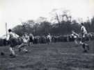 Gerry Watson tries a shot during the Amateur League semi final against Hallam FC at the Waterworks ground, Crookes (Hadfields sports ground), [c. 1950]