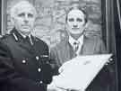 View: y13737 South Yorkshire Police: Chief Constable, R. S. Barratt QPM (left), presenting Gordon Selwyn Harris with the Provincial Police Award Certificate of Commendation for 1977